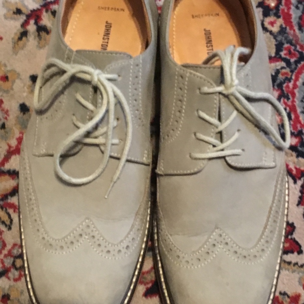 Grey suede wingtip shoes by Johnston & Murphy.